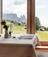 A table in the dining room with a view on the Seiser Alm