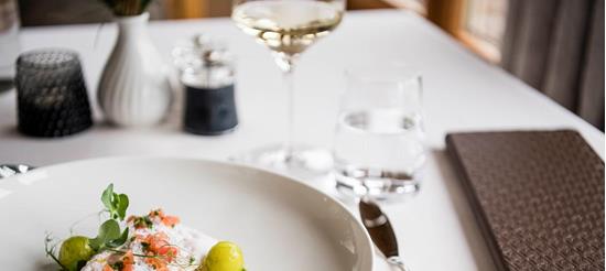 Tender fish with foam, diced tomatoes and vegetable spheres