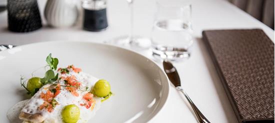 Tender fish with foam, diced tomatoes and vegetable spheres