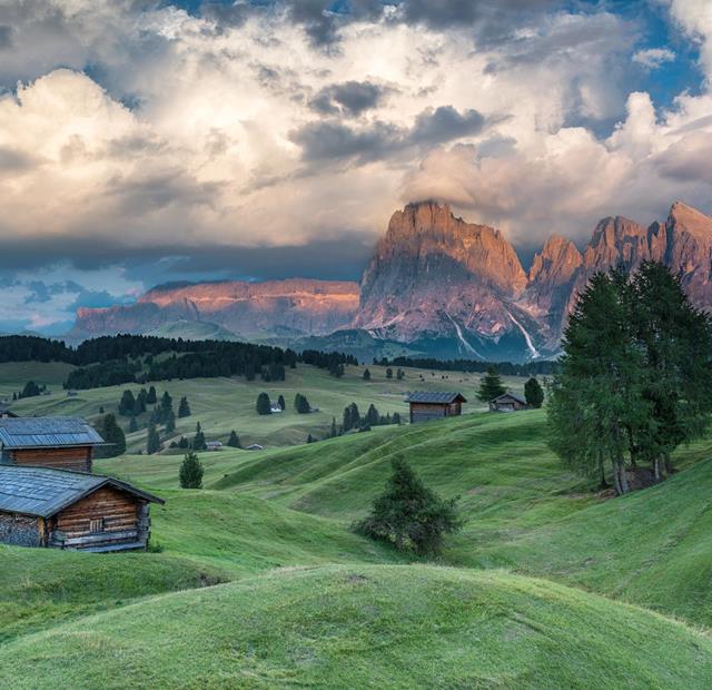 Alpenglow over the Dolomites – gentle hills, rustic huts and breathtaking evening light