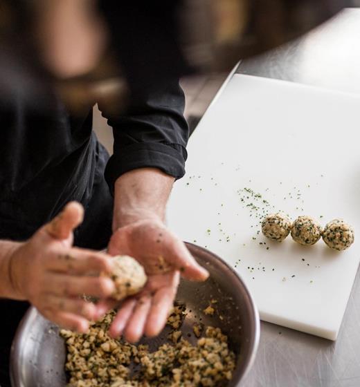 A chef is making typical South Tyrolean dumplings