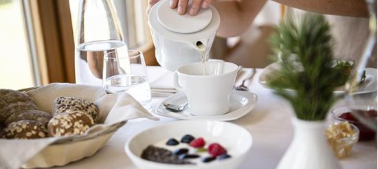 A woman is having breakfast