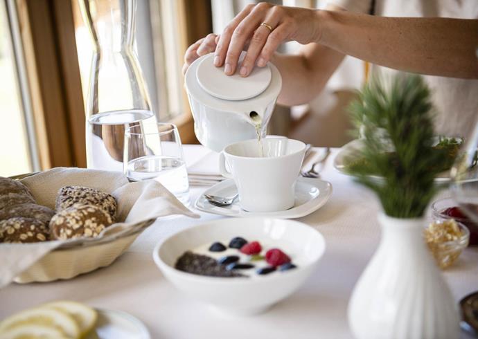 A woman is having breakfast